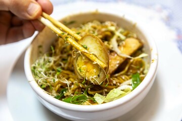 Traditional Japanese ramen or ramen with vegetable broth, grilled pork, oriental noodles and classic Japanese cuisine spices