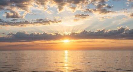 Obraz premium Sunset Over Ocean with Clouds
