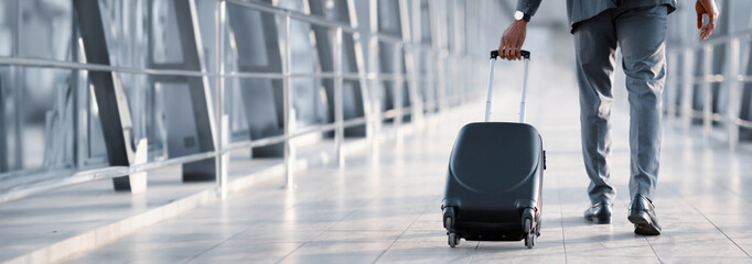 Cropped of African American Businessman At Airport Moving To Terminal Gate For Business Trip, Back...