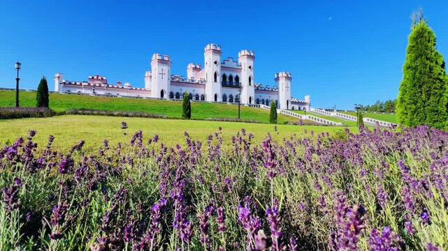Belarus, Puslovsky Palace, September 5, 2024: Kossovsky Autumn Castle. An old historical castle in Kosovki in sunny autumn weather. An architectural monument in the style of English Neo-Gothic. 4K