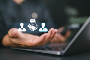 Negotiation concept. Businessman holding with handshake icon for negotiation, agreement, cooperation, business partnership.