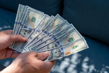 Hundred dollar bills fanned out