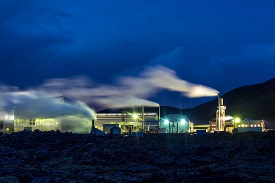 Geothermal power plant operating at twilight in Iceland, copy space