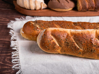 Artisan Herb-Crusted Breads on Rustic Wood