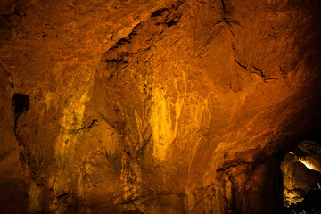 A close-up view of a limestone cave, filled with colorful,curious,wonderful. Lighting enhance texture and geological beauty.