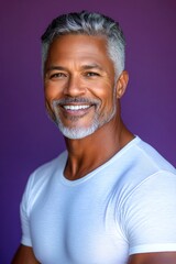Obraz premium A smiling man in a professional portrait session. A chic gentleman dressed in style and confidence. A happy and poised man radiating charm. A confident and radiant gentleman embracing his look.