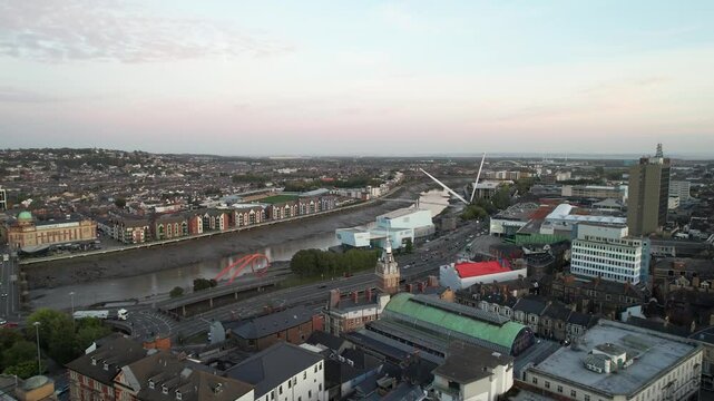 River passing through town near sea coast at low tide time. Aerial panoramic footage of city. Newport, Wales, UK
