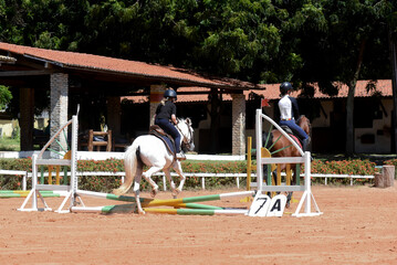 woman riding a horse, show jumping, equestrian show jumping, equestrian competition, rider show...
