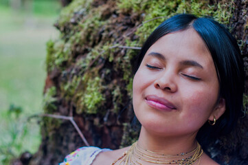 Indigenous woman enjoying nature, finding peace and tranquility in the forest