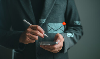 Email notification concept with businessman using smartphone and stylus. Digital envelope icons float around, symbolizing communication, mobile messaging, and modern email management.