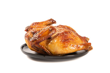 A whole delicious roasted chicken isolated on white background