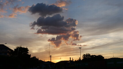 Scenic view dramatic beautiful sunset sky. Natural Sunset Sunrise on meadow silhouette shadow dark land. Vibrant dramatic sky on sunset, dawn, sunrise in Countryside. Landscape Colorful Sky At Sunset