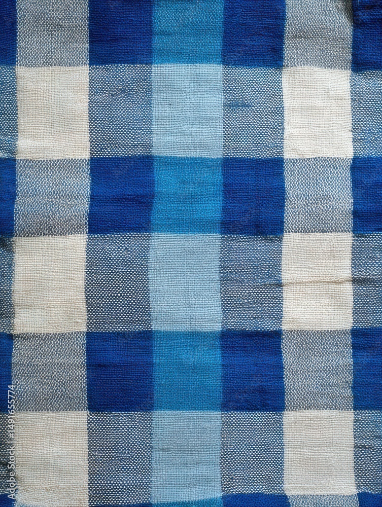 Poster blue and white checkered fabric close up top down shot showing woven texture and pattern design for 