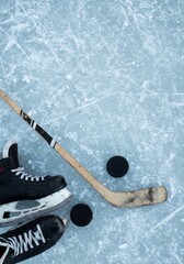 Ice Hockey Skates, Stick, Pucks on Ice