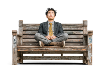 Young businessman meditating on wooden bench with transparent background