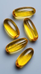 Fish Oil Capsules Arranged on Blue Background Overhead Close Up Studio Shot Health Supplement Omega Three Fatty Acid