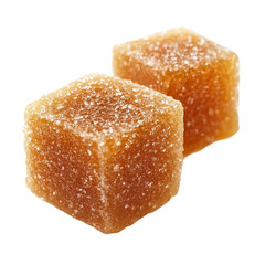 Two amber colored sugar coated cubes of candy close up