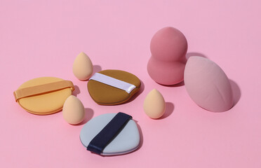 Set of makeup blenders, sponges on pink background. Creative layout. Minimalism creative beauty still life