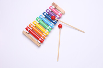 Children's multi-colored xylophone on white background