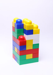 Obraz premium Pyramid with plastic constructor bricks on a white background
