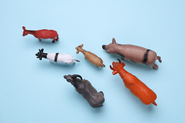 Toy farm set of animals on blue background