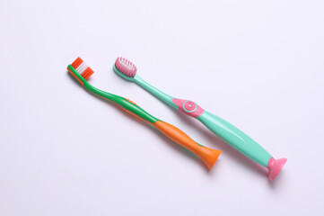 Children's plastic toothbrushes on a white background