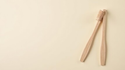 Two Eco-Friendly Bamboo Toothbrushes Resting on a Pale Yellow Background, Representing Sustainable Oral Hygiene Practices and a Commitment to Environmental Consciousness