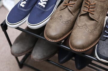 Metal shoe rack with shoes close up