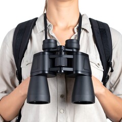 Woman holding binoculars wearing backpack against a white background neutral. Beige shirt in bright daylight