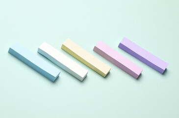 Multicolored stickers for notes on a pastel background