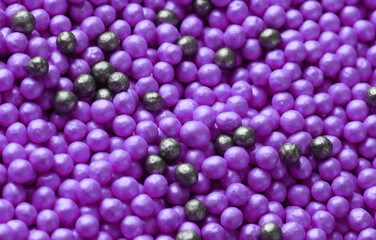 Black and purple powder balls. Meke up. Beauty concept
