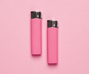 Lighters on a pink background. Minimalism.