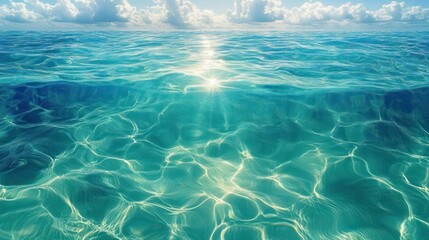 Calm ocean water with sunlight reflecting on gentle waves under a partly cloudy sky, creating a serene and peaceful atmosphere