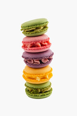 Colorful macarons stacked on top of each other in elegant display