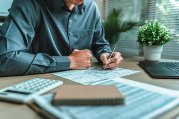 Businessman hand planning daily appointment and note at office desk. Planner plan Schedule Calendar and reminder. Business planning appointment concept.
