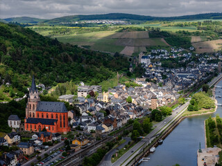 Oberwesel on the Rhine, Germany. Features Liebfrauenkirche (Red Church), St. Martin's Church, and Sch&ouml;nburg Castle overlooking the UNESCO Upper Middle Rhine Valley vineyards. Aerial shot.