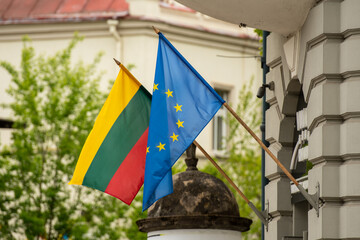Flag of European Union and Lithuanian flag waving together in the streets of Vilnius, Lithuania