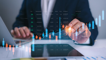 Businessman analyzing candlestick chart and stock market graph on digital dashboard, Showcase financial analysis, Trading strategy and investment trends in modern fintech and portfolio management.