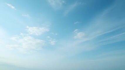 Serene Blue Sky with Wispy Clouds: Peaceful Nature Background