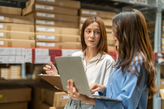 Female engineers team discussing inventory in warehouse logistics and supply chain planning, operation management, data analysis, warehouse shipping, inventory tracking, optimization and technology - Powered by Adobe