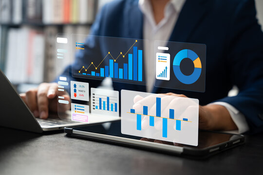 Professional businessman using laptop to review performance indicators, Business growth charts, Market research data for financial and investment decisions. Strategic planning and corporate success.