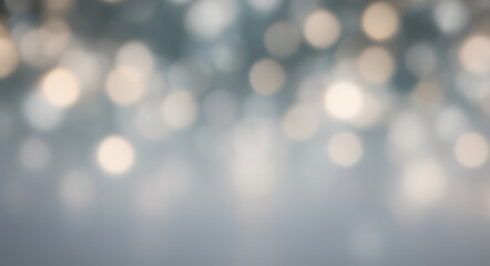 Bokeh effect with blurred lights in white gold and blue gray tones.