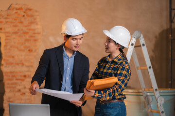 Fototapeta premium Construction engineers discussion with architects at construction site or building site.