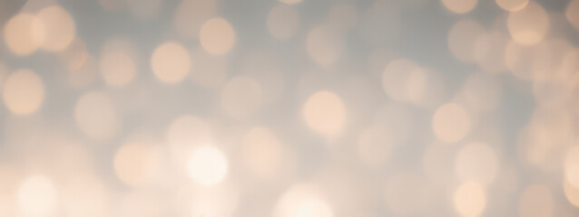 Obraz premium Abstract bokeh background with soft light and blurred golden circles.