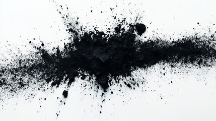 Black powder explosion on white background, creating a dynamic and abstract pattern with splatters and texture