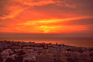 Fototapeta premium Sunrise over city, Santorini, Greece