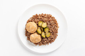 Buckwheat with meatballs and roasted Brussels sprouts makes a wholesome meal