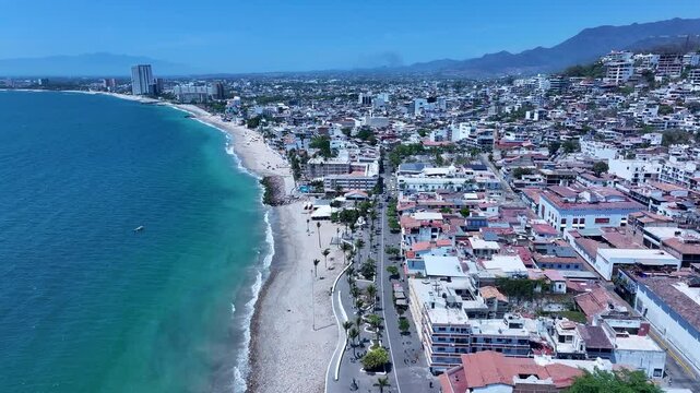 Aerial Mexico Puerto Vallarta coast city center Malecon 1 4K. Mexican beach resort city Pacific Ocean. International tourist destination. Tourism is economy. Outdoor luxury recreation. Cruise port.