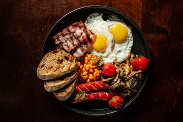 A mouthwatering spread of breakfast with perfectly cooked eggs, crispy bacon, and savory sausages