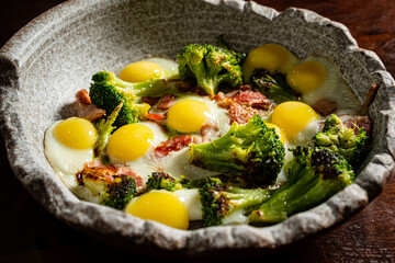 A lovely plate features fresh broccoli and perfectly cooked sunny-side-up eggs for a cozy meal